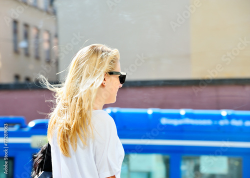 Blonde woman with sunglasses in the city