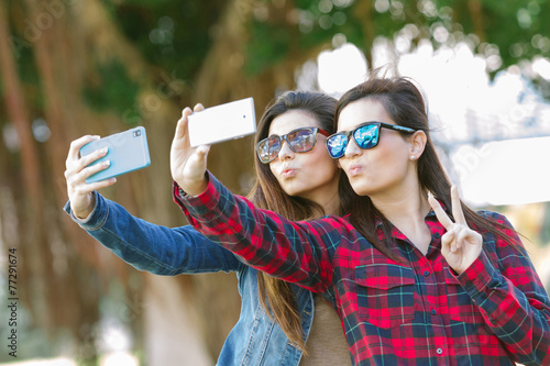 Happy girls taking a Selfie photo