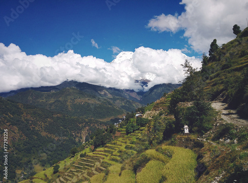 Terraces in Mountains with Clouds and Annapurna South
