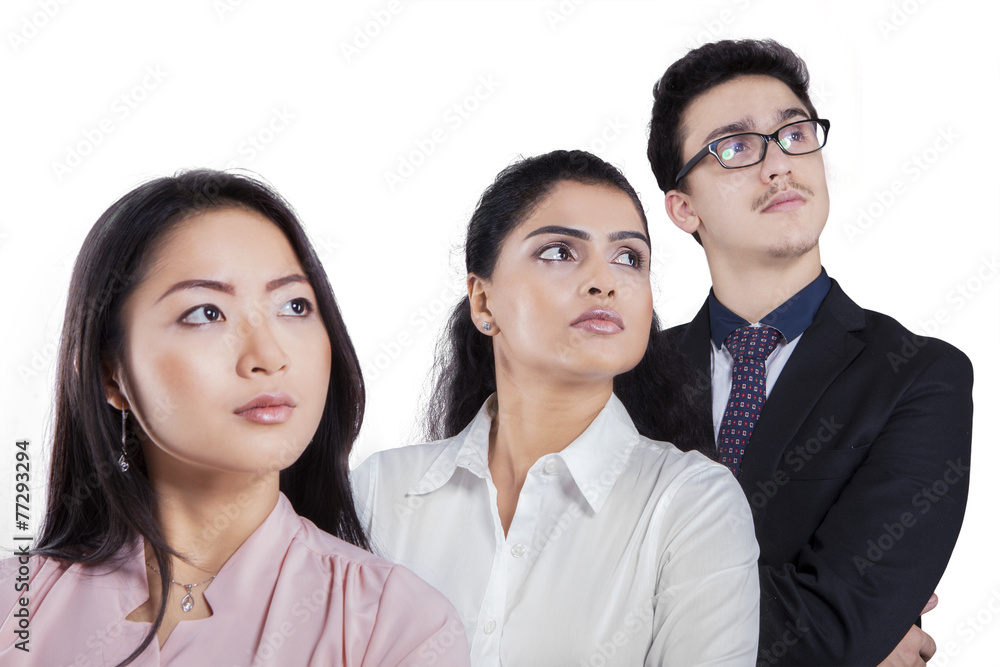 Multi ethnic employees looking at copyspace Multi ethnic employees looking at copyspace