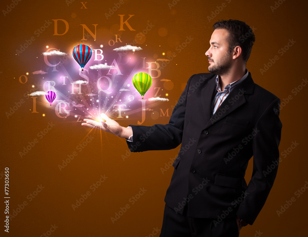 Letters and balloons in the hand of a businessman Letters and balloons in the hand of a businessman
