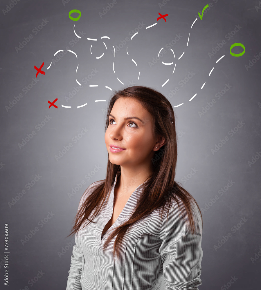 Young woman thinking with abstract marks overhead Young woman thinking with abstract marks overhead