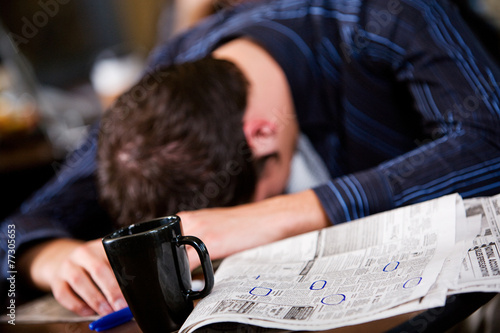Coffee: Anonymous Businessman Reads Paper Looking at Job Listing