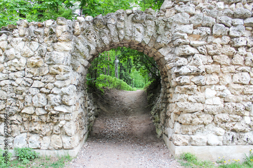 Fototapeta Naklejka Na Ścianę i Meble -  The road through the stone archway