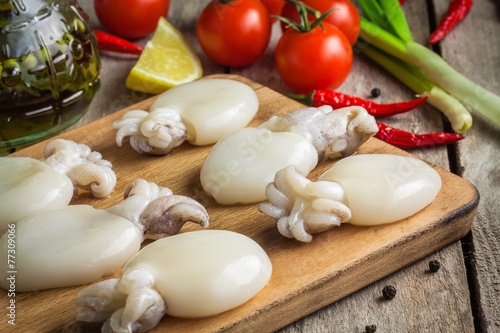 Raw babies cuttlefish on a cutting board