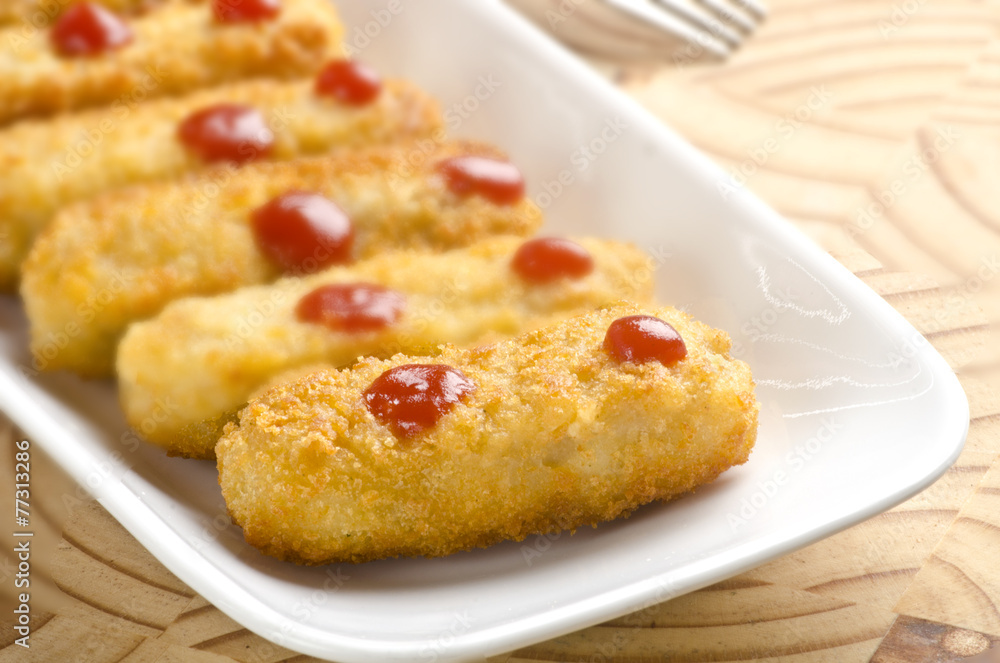 Fish and chicken fingers with sauce Fish and chicken fingers with sauce