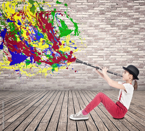 little girl playing clarinet photo