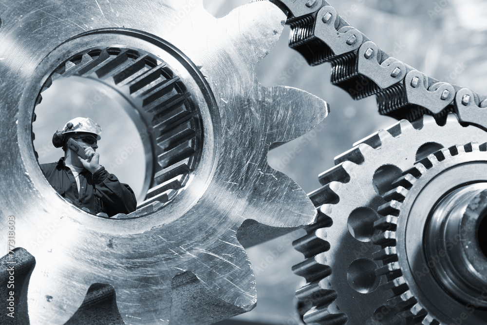 engineer seen through a large cogwheels axle, chain powered engineer seen through a large cogwheels axle, chain powered