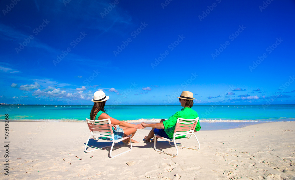 Young happy couple during tropical beach vacation Young happy couple during tropical beach vacation