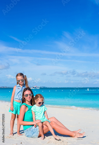 Mom and two little girls during beach vacation