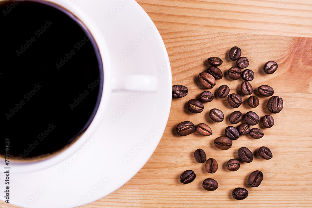 Fototapeta premium cup of coffee with coffee beans