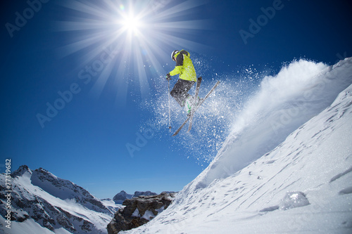 Skier in high mountains