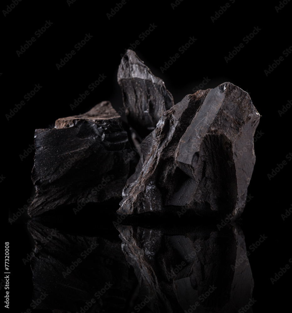 Coal lumps on dark background