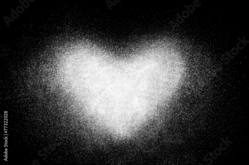 Freeze motion of white heart shaped powder