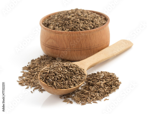 cumin seeds on white background photo