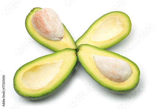 Halves of fresh avocado isolated on white background