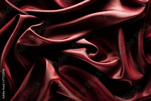 Abstract wave textile texture or background in marsala color