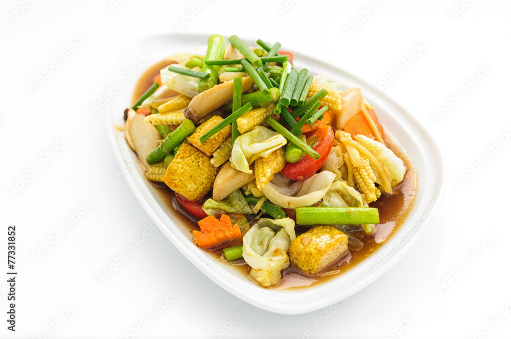 Fried vegetables Thai style on white plate