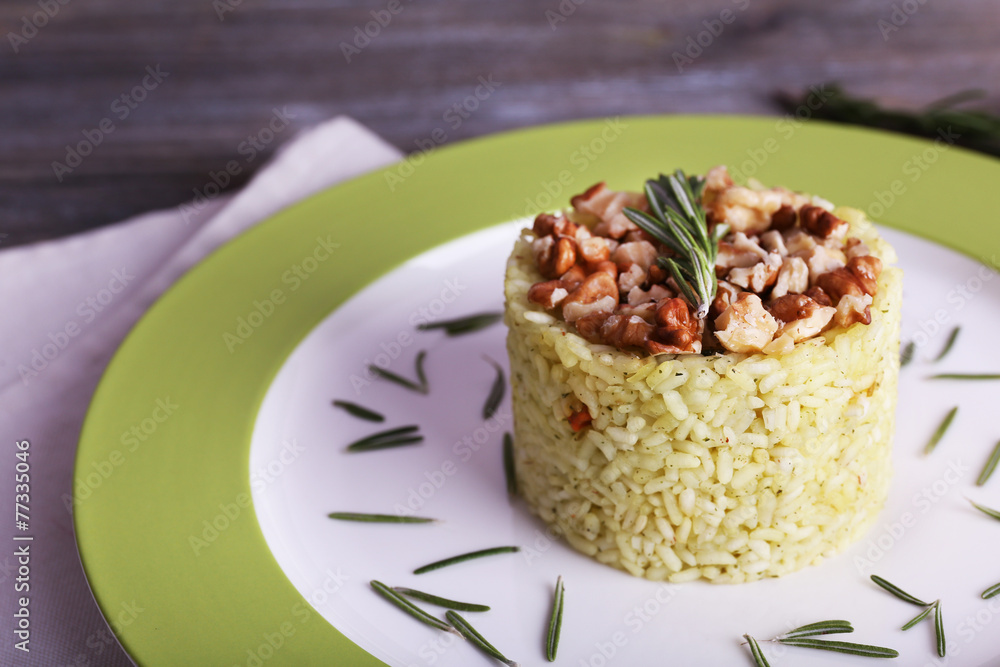 Rice with walnuts and rosemary in plate Rice with walnuts and rosemary in plate