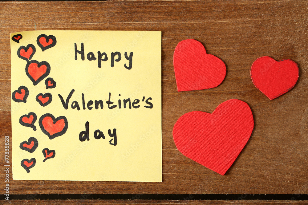 Valentines day note on wooden background Valentines day note on wooden background