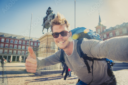 student backpacker tourist taking selfie photo with mobile phone
