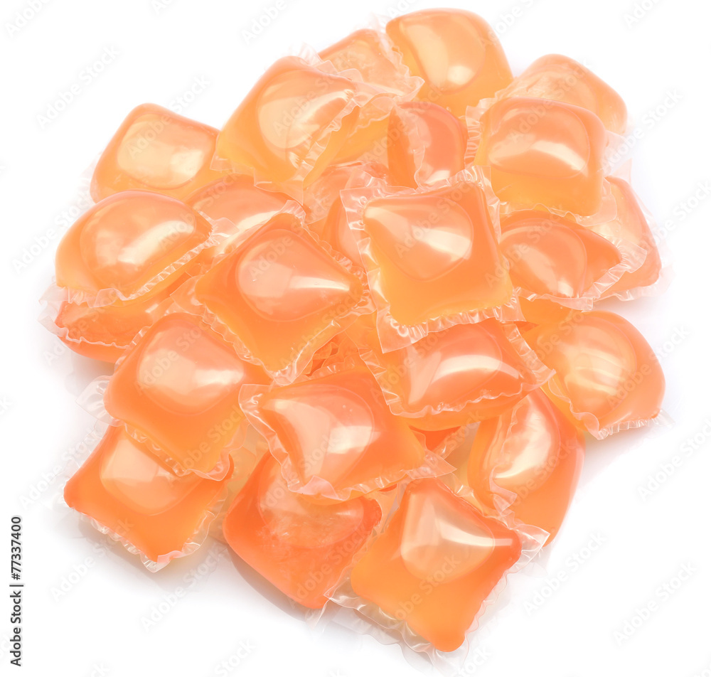 Gel capsules with laundry detergent isolated on white Gel capsules with laundry detergent isolated on white