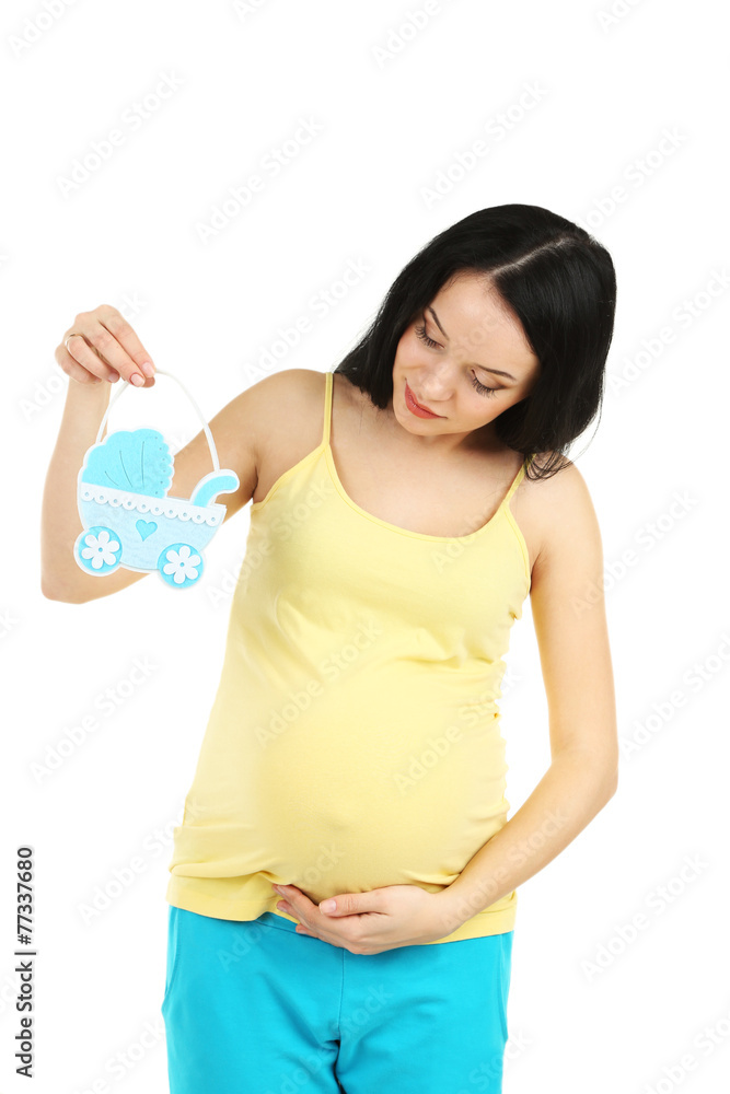 Beautiful young pregnant with baby toy isolated on white Beautiful young pregnant with baby toy isolated on white