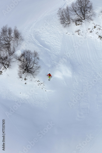 Skier in deep powder, extreme freeride