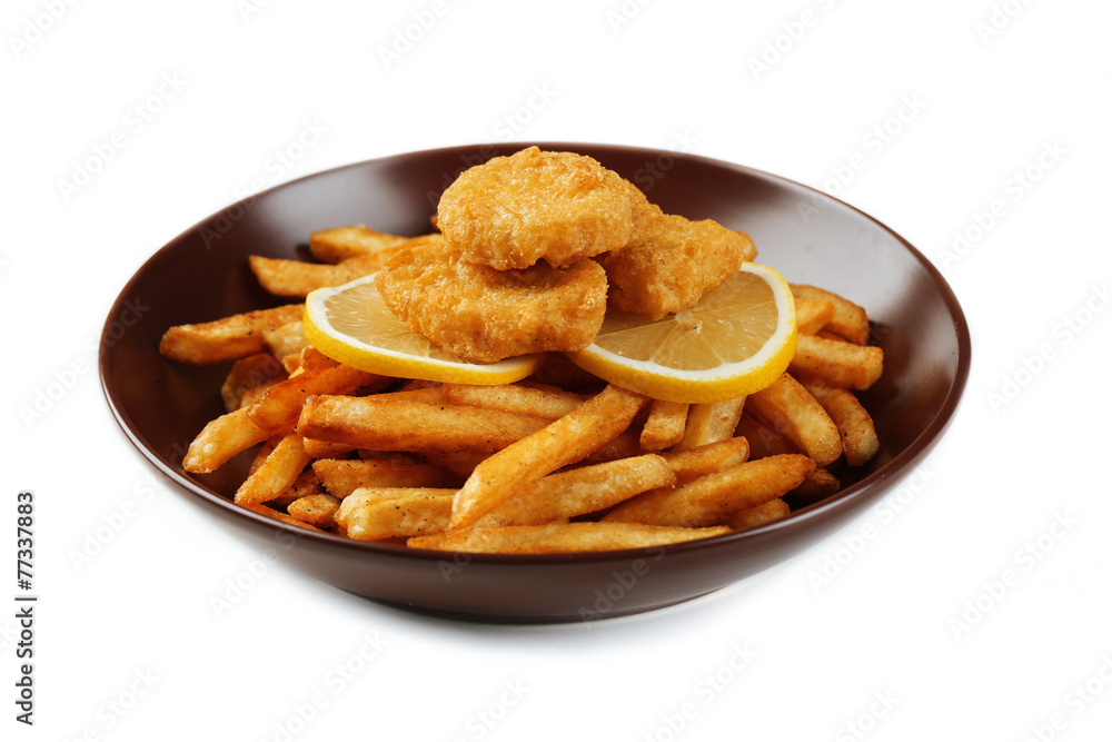 Breaded fried chicken nuggets and potatoes with sliced lemon in Breaded fried chicken nuggets and potatoes with sliced lemon in