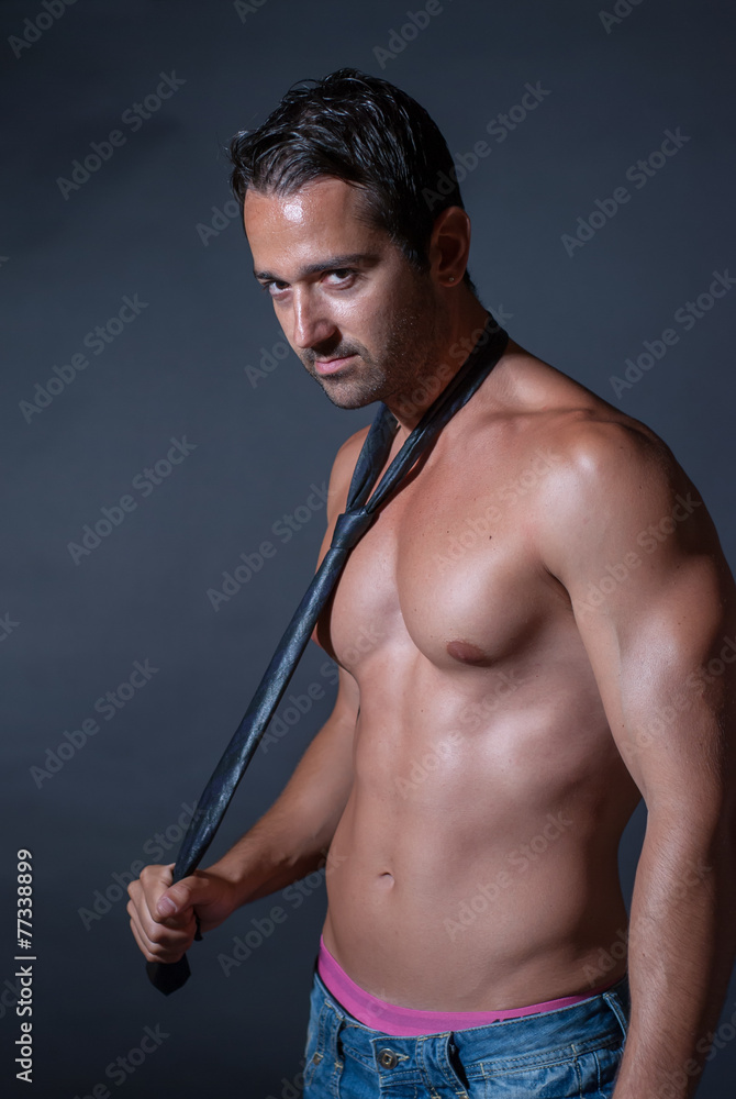 Muscle sexy man posing, wearing only tie and jean Stock Photo | Adobe Stock