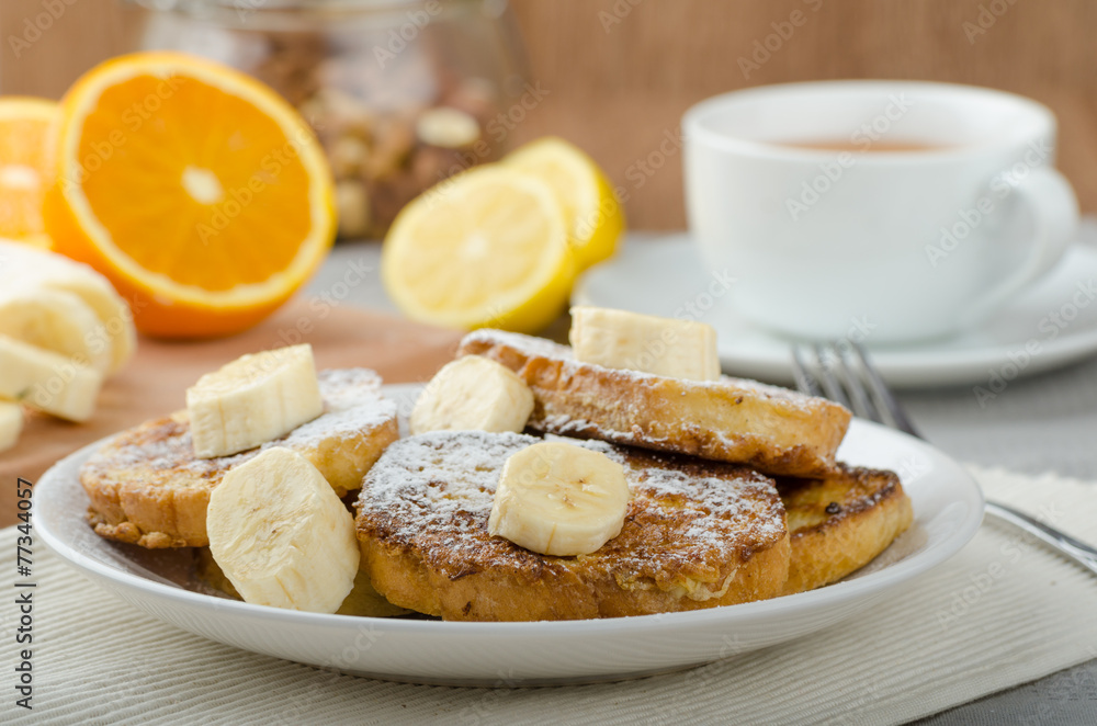 French toast to sweet, with banana sprinkled with sugar French toast to sweet, with banana sprinkled with sugar