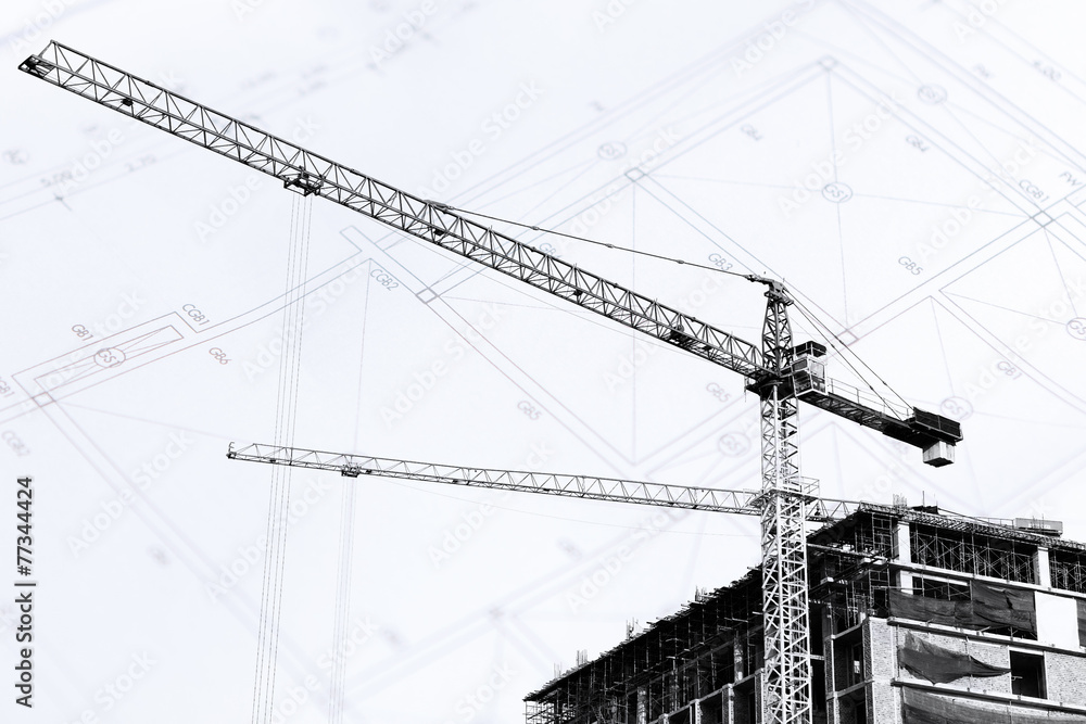 Construction site with cranes on silhouette background