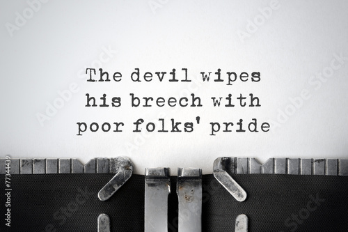 Pride. Inspirational quote typed on an old typewriter.