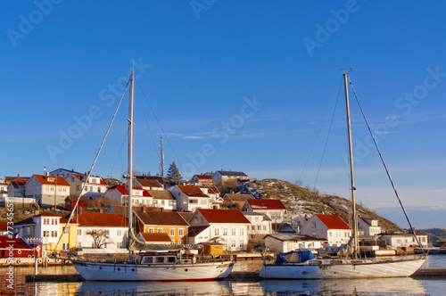 Sailboats at the dock covered with frost photo