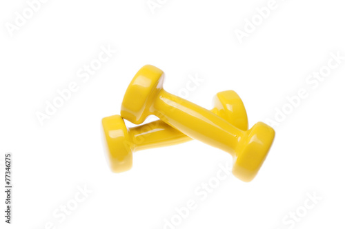 Pair of yellow dumbbells Isolated on white background