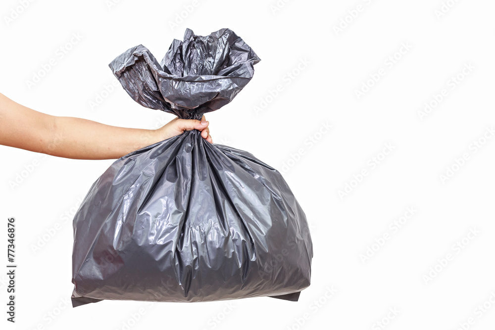 Hand holding garbage bag Hand holding garbage bag