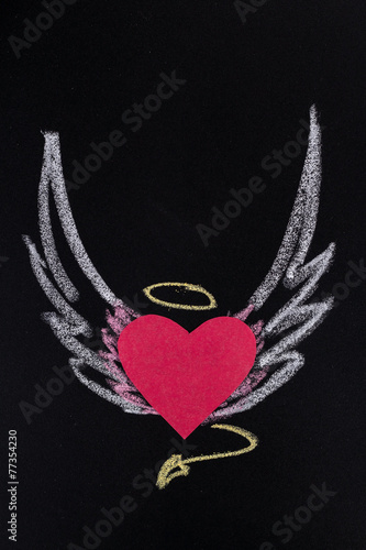 paper heart with pictured chalk wings on black background