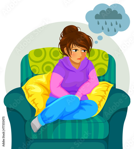 sad girl sitting on the sofa and thinking negative thoughts