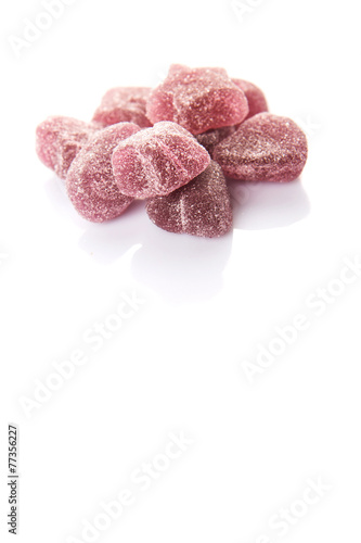 Purple colored sugar jelly candy over white background