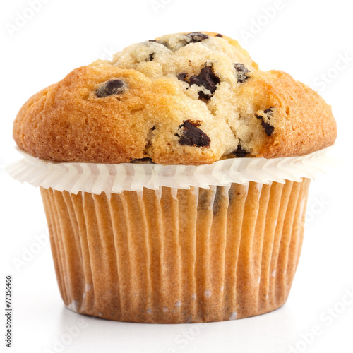 Canvas Print Single light chocolate chip muffin in wax liner on white.