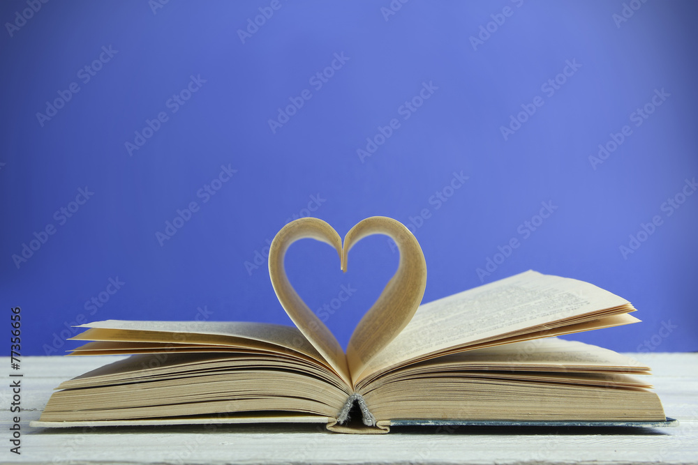 book of love with a heart on a blue background book of love with a heart on a blue background