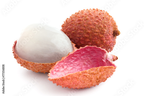 Single litchi with skin removed and flesh. On white.