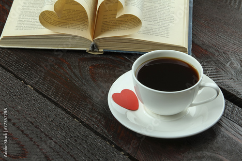 Cup of coffee with book on valentines day