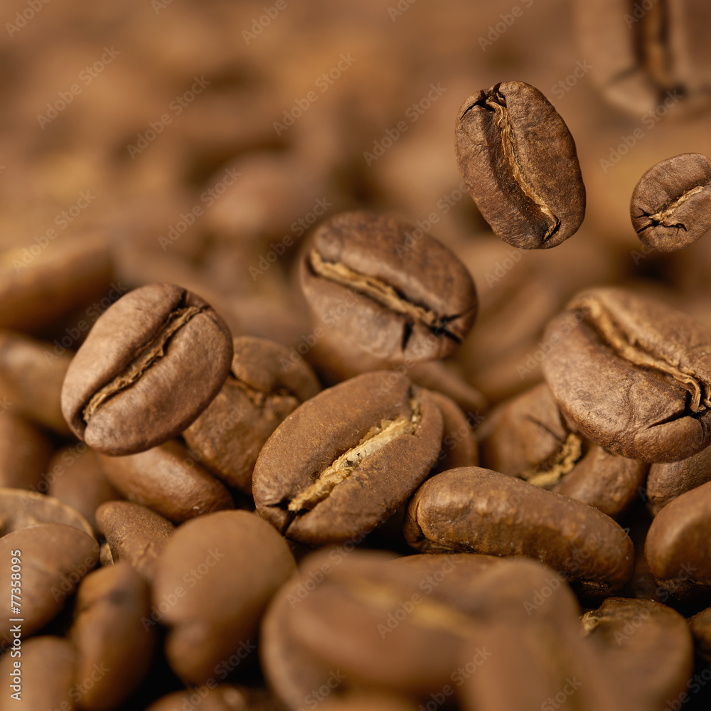 Closeup of coffee beans with focus on one Closeup of coffee beans with focus on one