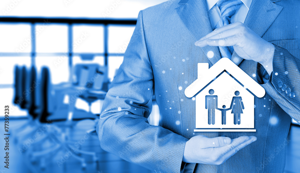 businessman protecting family in home with hands businessman protecting family in home with hands