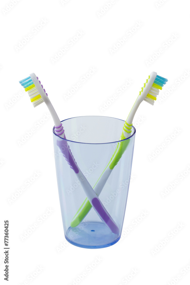 toothbrushes in a glass isolated toothbrushes in a glass isolated