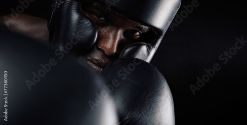 Close-up of african male boxer exercising