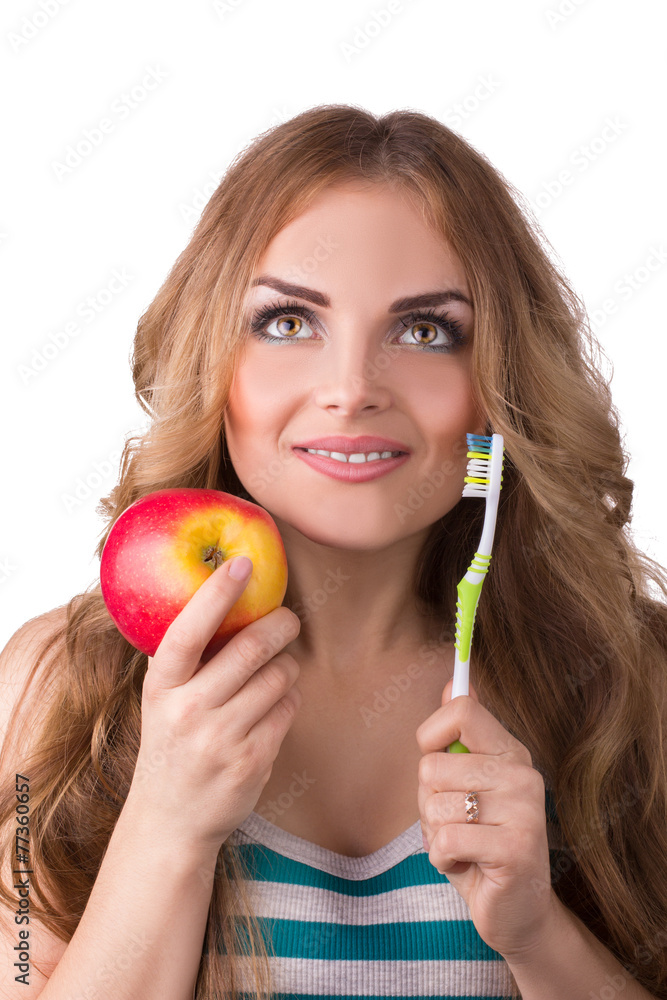 Smiling woman with apple and toothbrush isolated on white Smiling woman with apple and toothbrush isolated on white