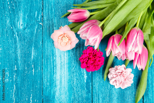 Fototapeta Naklejka Na Ścianę i Meble -  Beautiful pink tulips on blue wood background