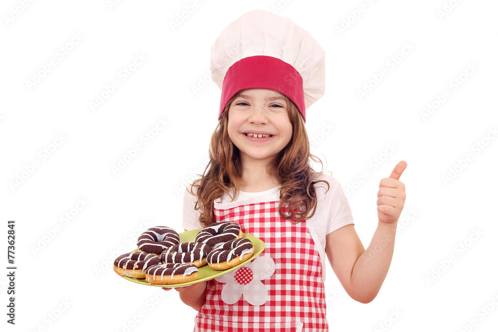 happy little girl with chocolate donuts and thumb up happy little girl with chocolate donuts and thumb up